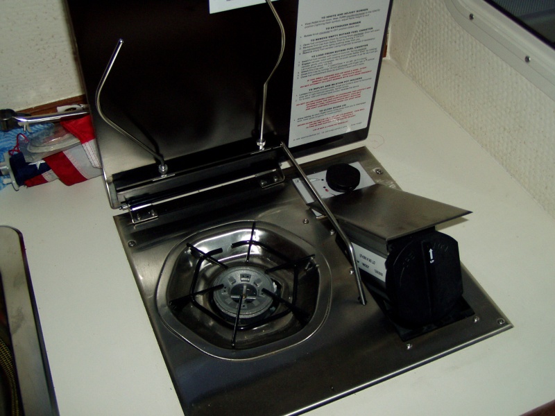 stove open with canister door open