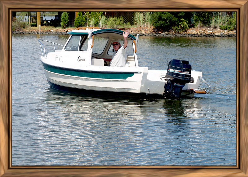 That's me in Jefferson Creek off the lagoons where I am moored. Headed out to Little Assawomen Bay and eventually where I met another 16' C-Dory.
A good friend took this with her new lens and she framed it to perfection.