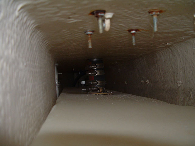 The filler hose is about a half inch longer than the two necks.