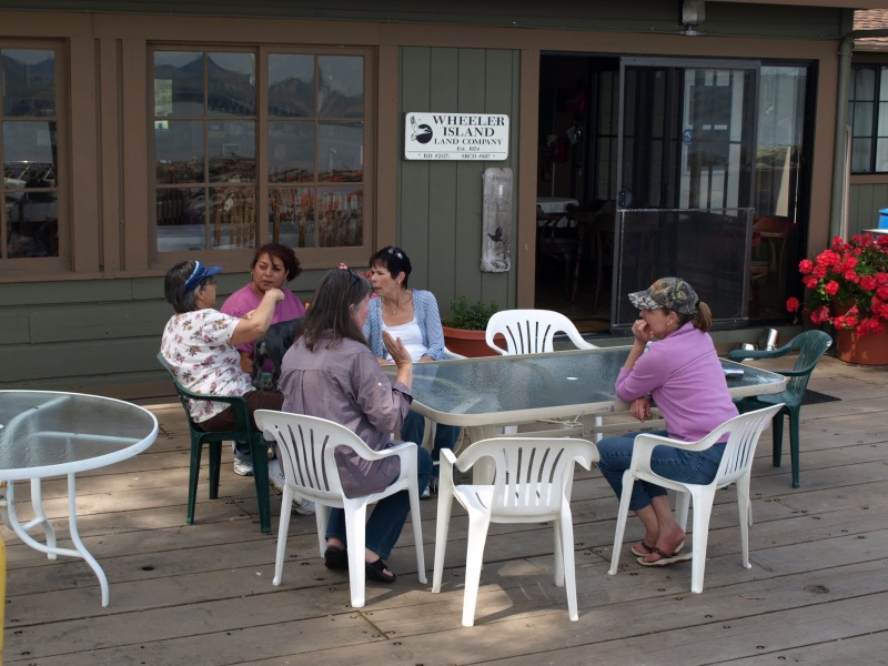 The girls relax on the dock of the Wheeler Island Duck Club.