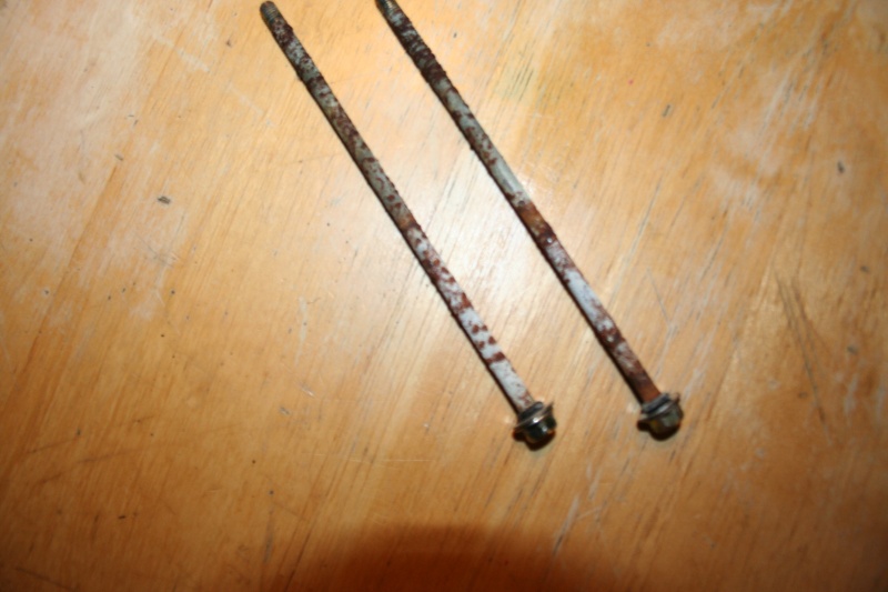 these two bolts pass thru the motor and hold the brush plate and motor in place, the are covered in corrossion