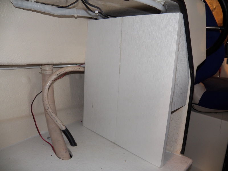 This is my new electrical cover.  It is two pieces of 10" Azek plastic trim glued together.  Cheaper than Starboard.  Hold screws better than SB.  Glues better than SB.  Floats better than SB.  I prefer adding things that float to a boat.