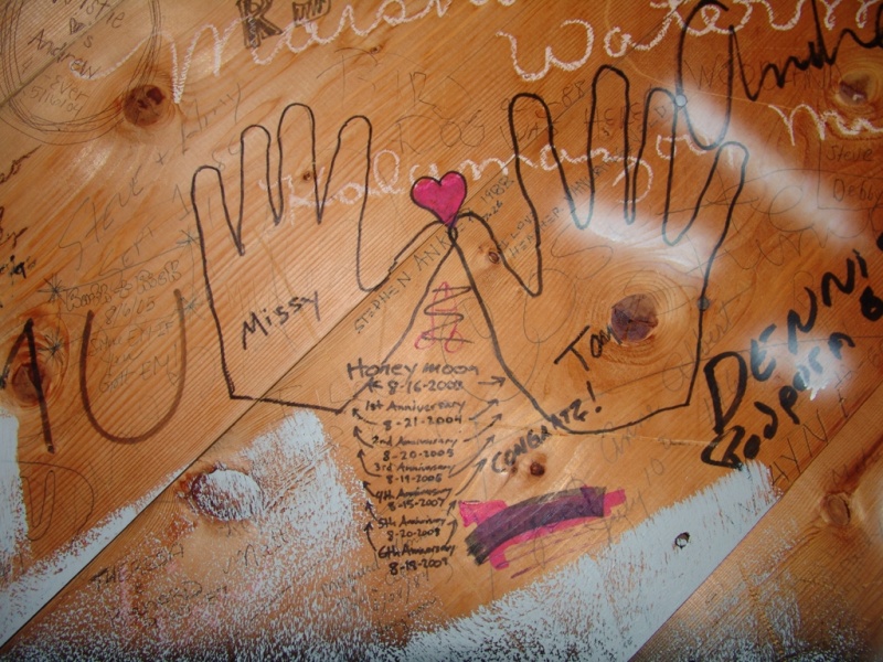 This is on the inside of a lookout tower/giftshop in Michigan's UP. You are allowed to write all over the walls on the inside unless it's naughty.