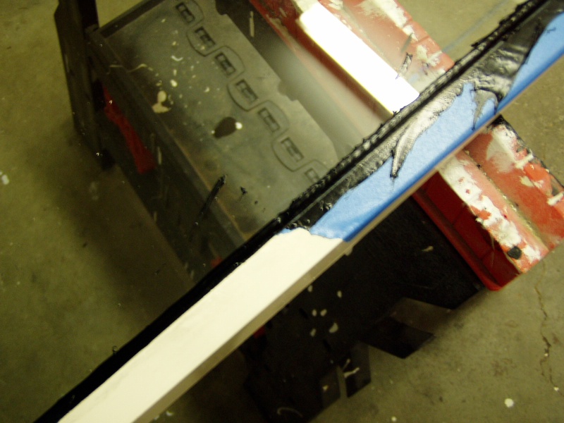 This shows the effect of masking.  Excess urethane can be easily trimmed from the glass but not the frame.