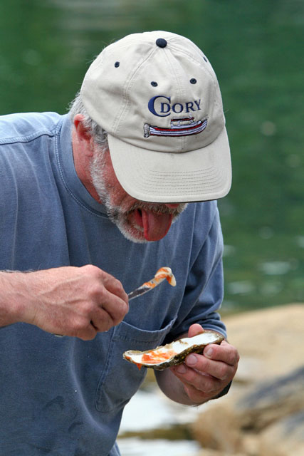 Tom enjoying a oyster.
