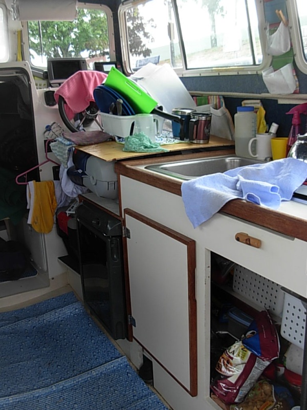 Two Bears in "living" mode.  The plywood sheet that covers the cabnet is now placed over the helm seat greatly expanding the work surface.