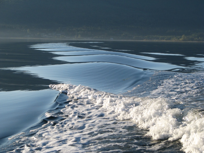 WAKE IN THE MORNING SUN.  Sequim Bay early morning run. (Look for the nuances of the light on the water.  hh)