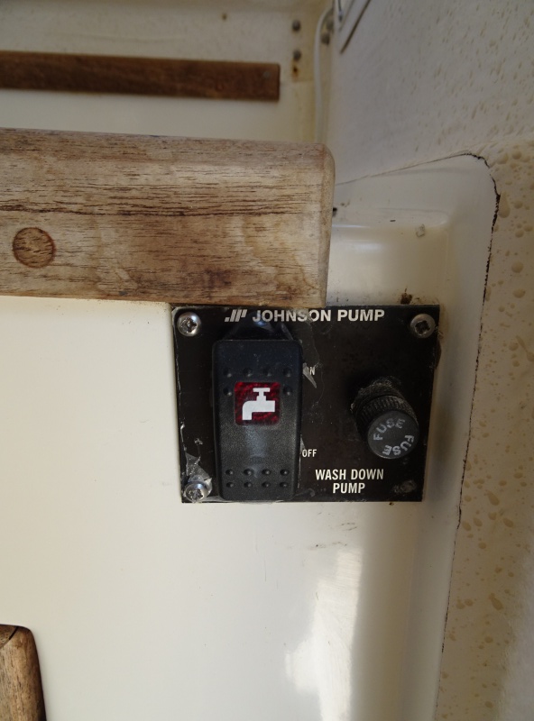 wash down pump switch (outlet on side of splash well.
