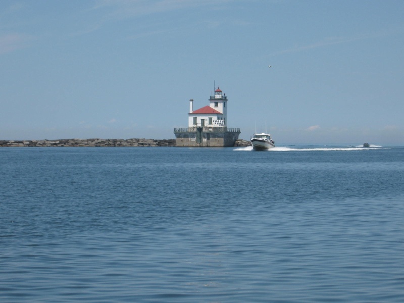 We saw a weather window for crossing Lake Ontario from Oswego New York to Kingston Ontario.  We got to the Light House at Oswego about 2pm and headed out for Kingston - about 60 miles across Lake Ontario.  Its a long trip for the guys in the big trawlers.  The CD25 did it in a little over 2 hours