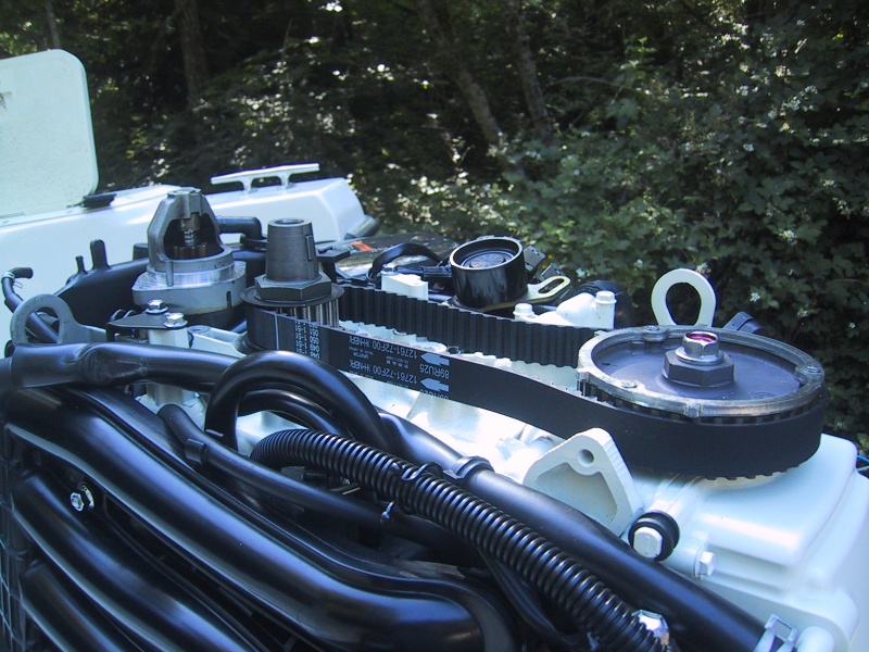 With timing marks properly aligned, remove belt, install new one, and reassemble.
Flywheel installs with notch on keyway on tapered shaft. Belt tension pulley has spring loading for belt tension, over tension can damage oil pump drive at bottom of cam shaft.